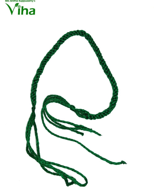 Lakshmi Kuber Thread, a green braided cord with multiple loose ends