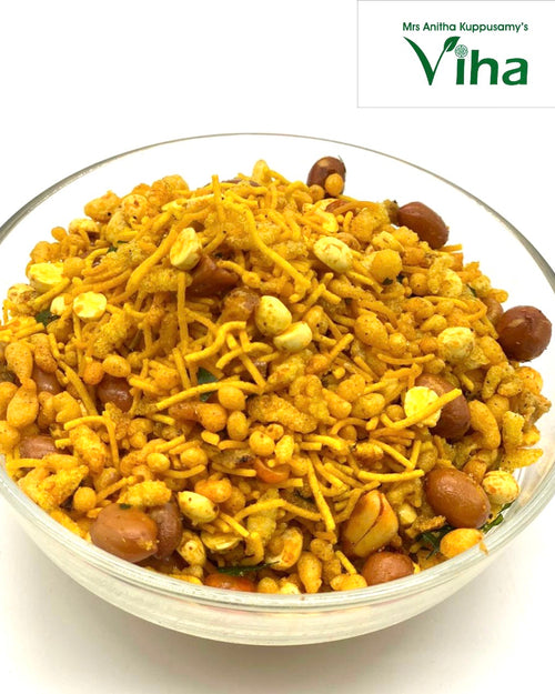 Traditional Mixture, a transparent glass bowl filled with a mix of yellow noodles, brown peanuts, and small puffed pieces