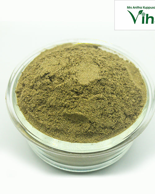 Bhringraj Powder / Karisalankanni Keerai Powder, a round, clear glass bowl holding fine, textured green powder mounded high