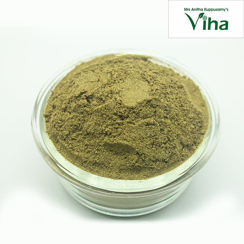 Bhringraj Powder / Karisalankanni Keerai Powder, a round, clear glass bowl holding fine, textured green powder mounded high