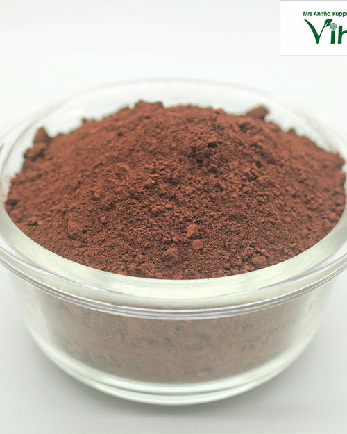 Kolam Kaavi Powder, brown powder in one clear glass bowl with a rounded rim