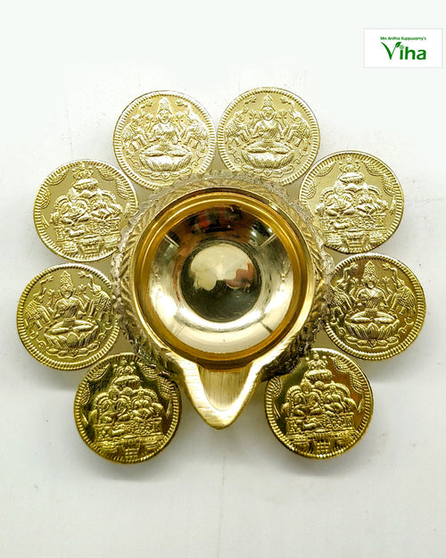 Brass Aishwarya Lakshmi Kubera deepam, central oil bowl ringed by eight embossed Lakshmi coins