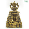 Kuberar in brass, a standing figure above two seated figures, with pots and coin heaps across the base