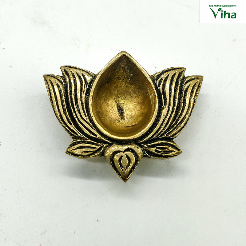 Lotus lamp in antique brass, teardrop oil well set against layered lotus petals
