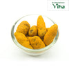Poosu Manjal (Turmeric), nine rough yellow-orange turmeric roots piled inside a clear round glass bowl