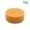 Papaya Soap, a round, thick orange soap cake with a smooth, matte finish resting on a plain white background