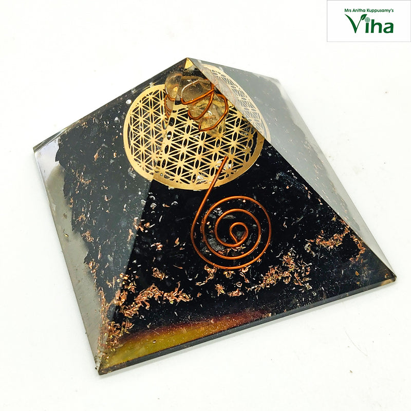 Black Tourmaline Pyramid for Vastu, pyramid with a gold flower-of-life emblem and a copper spiral wire design