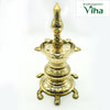 Tortoise kuthu vilakku in brass, five-point oil well on a ringed stem rising from a tortoise base