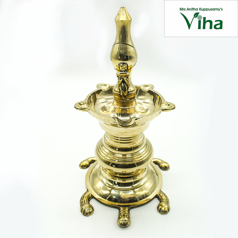 Tortoise kuthu vilakku in brass, five-point oil well on a ringed stem rising from a tortoise base