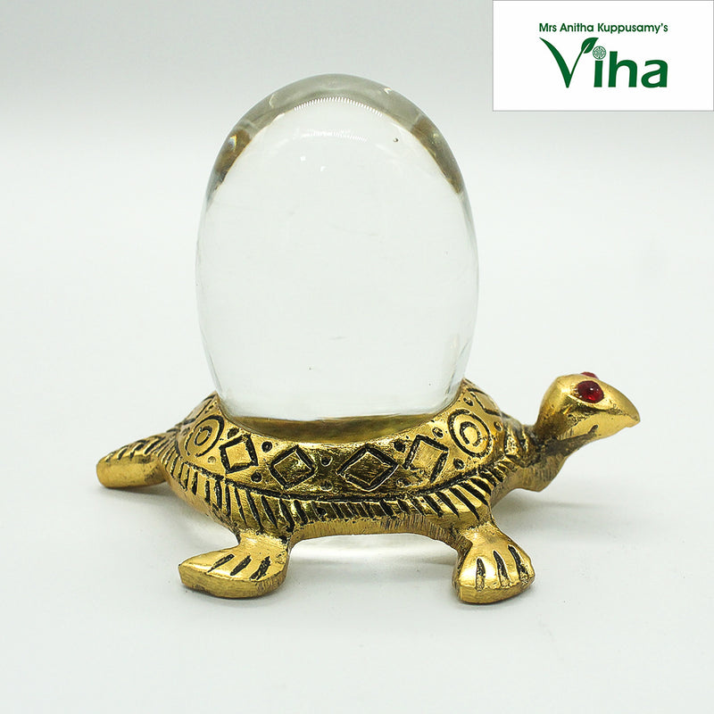 Tortoise Sphatik Ling (Kachua) with a turtle carrying an oval sphere and red stone eyes