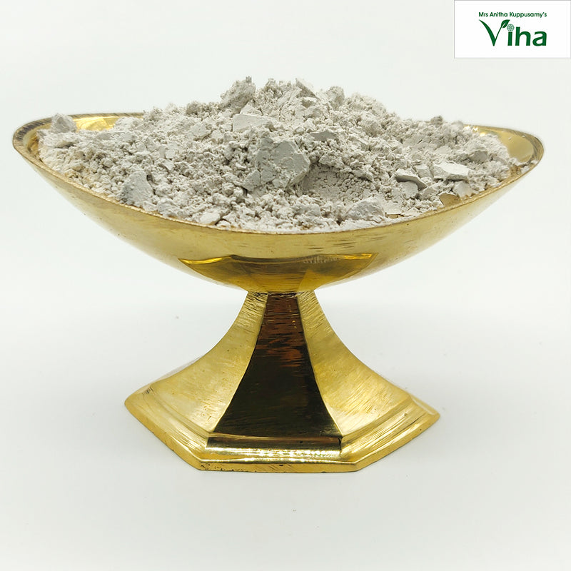 Cow Dung Vibhooti, a gold-toned footed bowl holding off-white powder